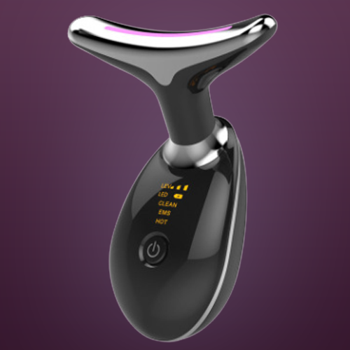 black pure aura face massager against a purple background.